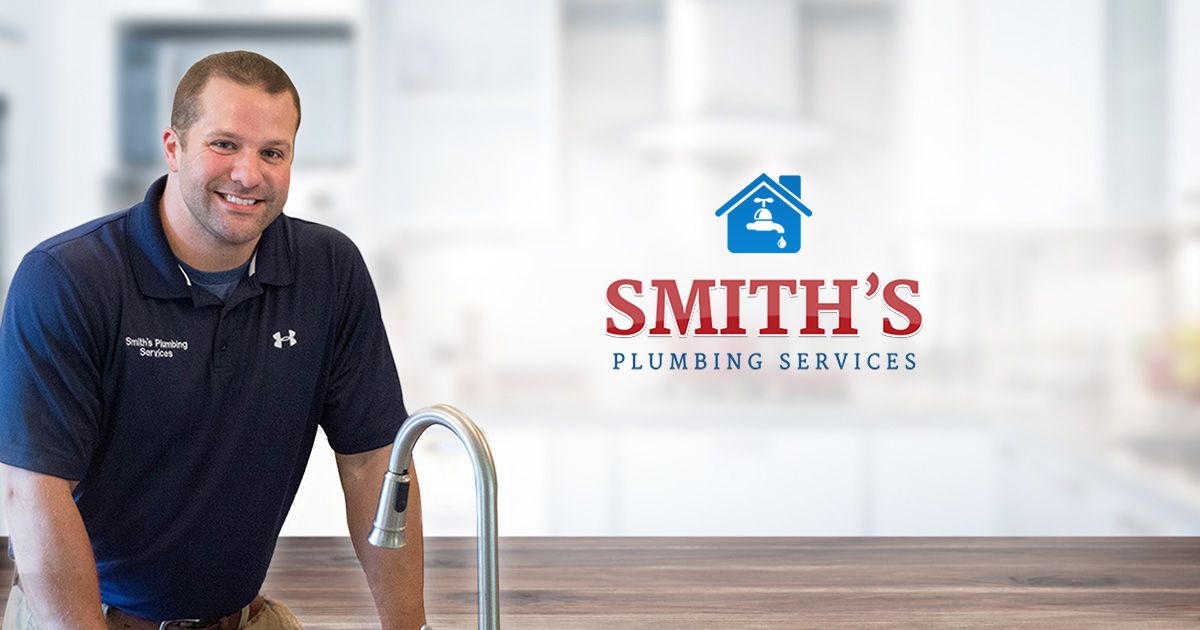 Smith's plumbing plumber Standing in front of sink in Covington house
